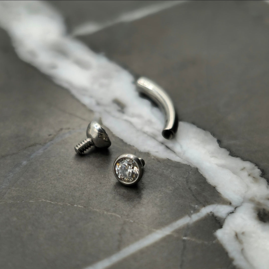 2.5mm Bezel Set Zirconia Curved Barbell